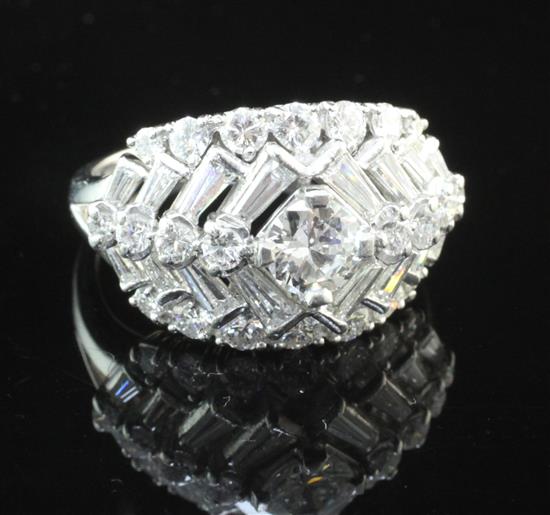 A platinum and iridium, diamond cluster ring, size R.